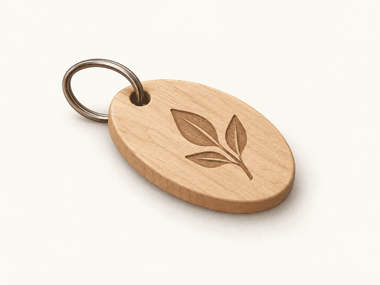 Illustration of a wooden key tag engraved with a leaf motif